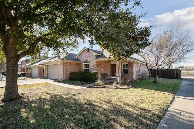 ranch-style home featuring a front lawn and a garage