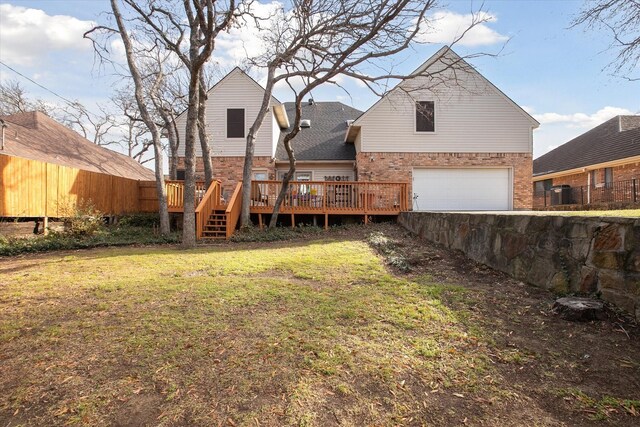 view of yard featuring a deck and a garage