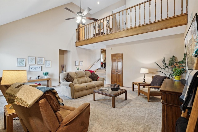 living room featuring ceiling fan, light colored carpet, and high vaulted ceiling