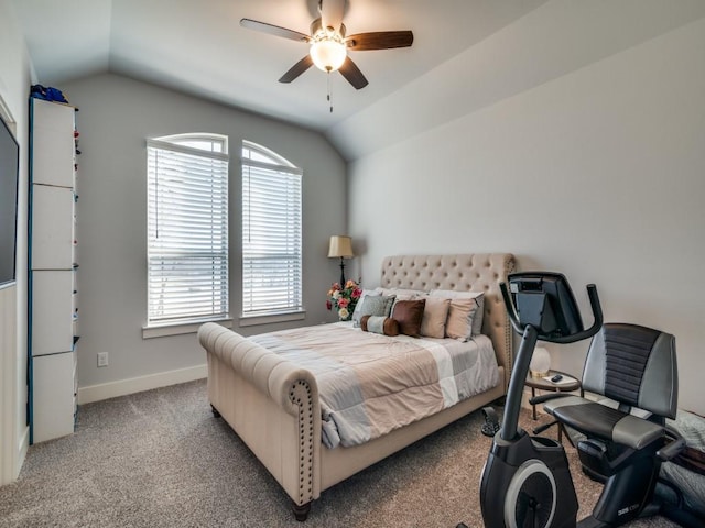 carpeted bedroom featuring multiple windows, ceiling fan, and vaulted ceiling