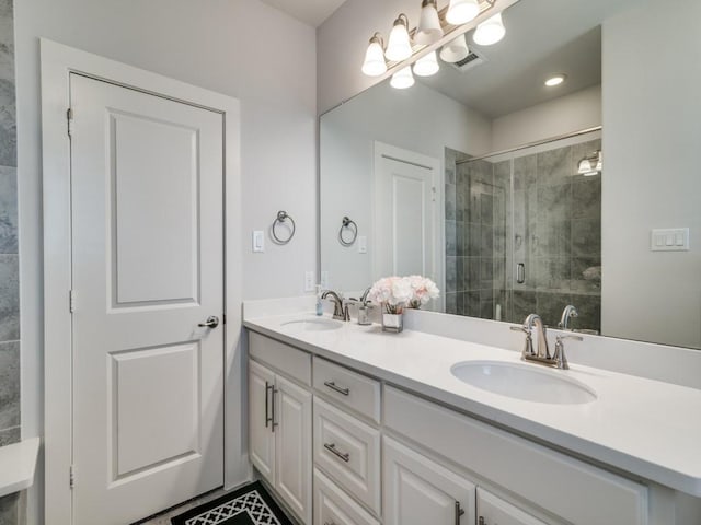 bathroom with vanity and an enclosed shower