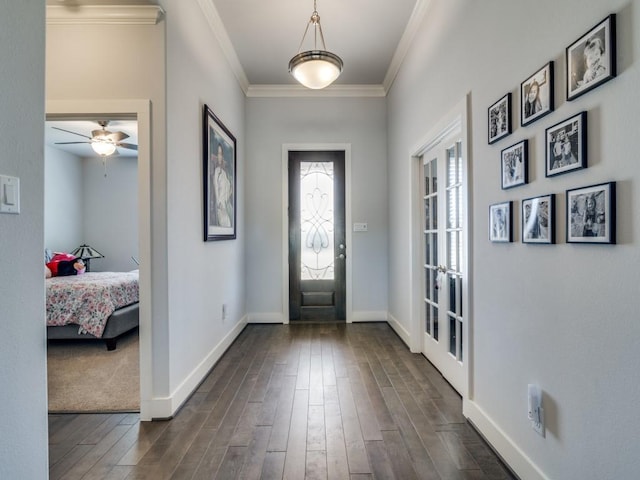 entryway featuring french doors, dark hardwood / wood-style floors, ceiling fan, and crown molding