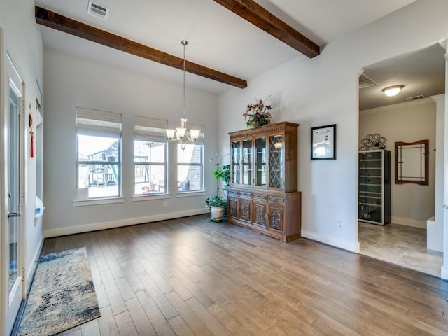 interior space with wine cooler, beamed ceiling, a chandelier, and light hardwood / wood-style floors