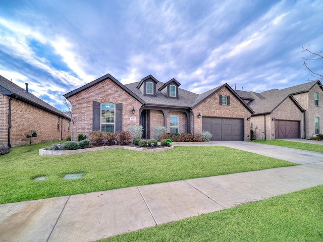 view of front of house with a front lawn and a garage