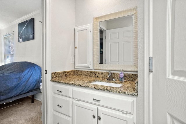 bathroom featuring vanity and ornamental molding