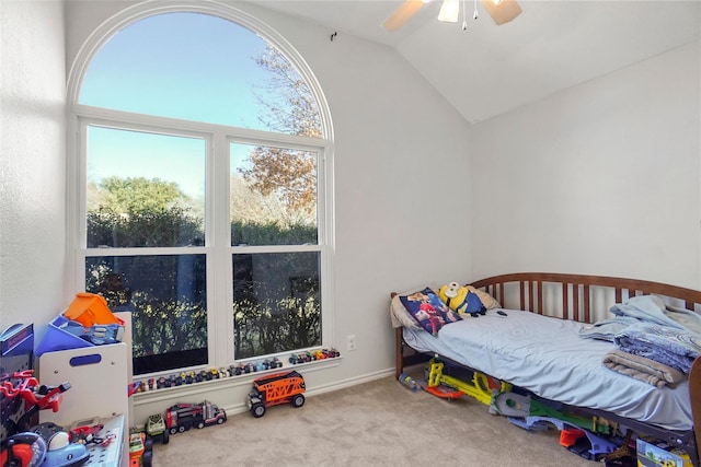 carpeted bedroom with ceiling fan and lofted ceiling