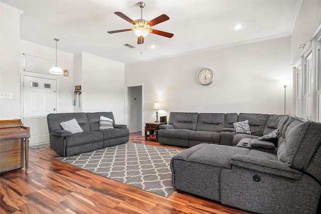 living room with crown molding, hardwood / wood-style floors, and ceiling fan