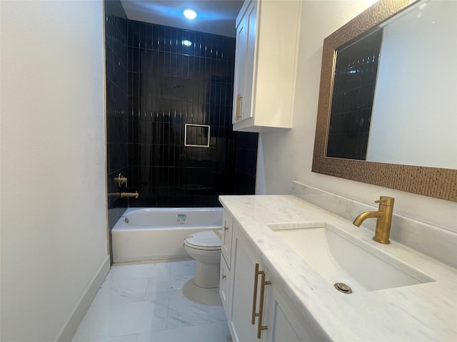 full bathroom with tiled shower / bath, vanity, and toilet