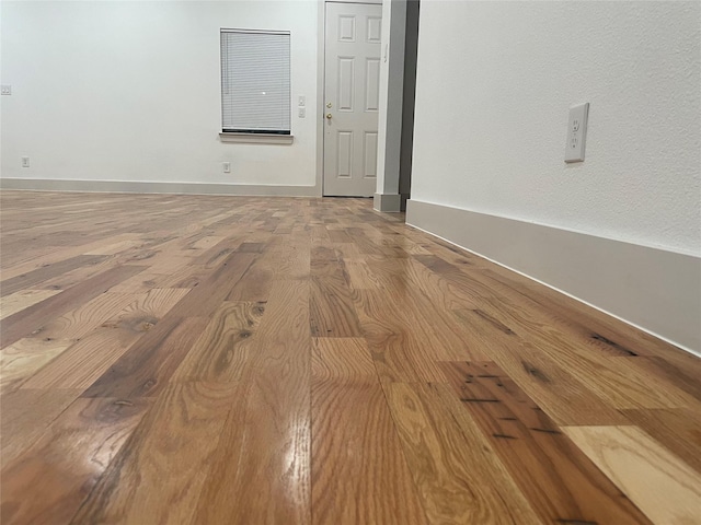 empty room featuring wood-type flooring