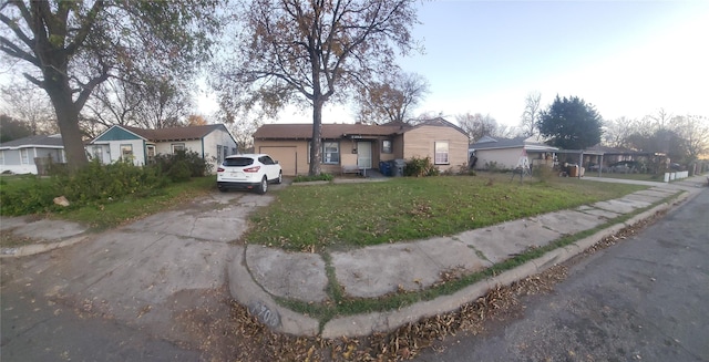 view of front of house with a front lawn and a garage