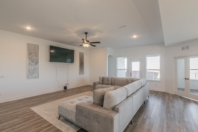 living room featuring dark hardwood / wood-style floors and ceiling fan