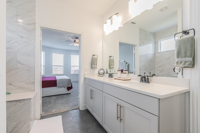 bathroom featuring vanity, tile patterned floors, and ceiling fan