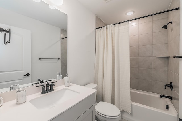 full bathroom featuring vanity, toilet, and shower / bath combo with shower curtain