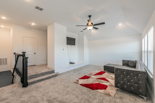 interior space with ceiling fan, carpet, and vaulted ceiling