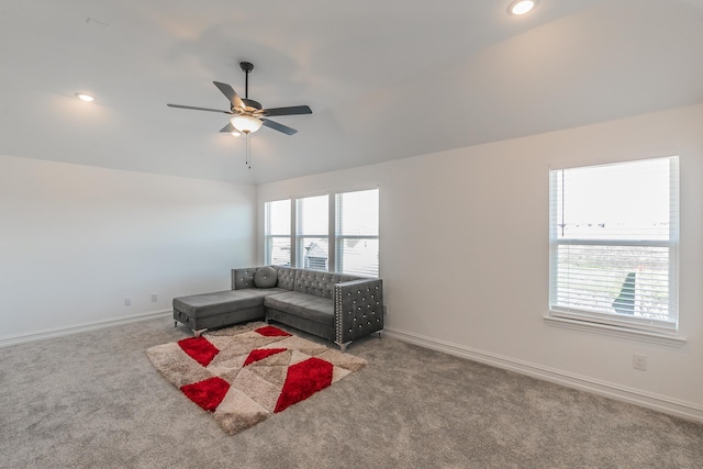 unfurnished living room featuring carpet flooring, ceiling fan, and lofted ceiling