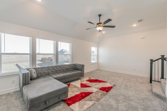 living room with carpet floors, ceiling fan, and lofted ceiling