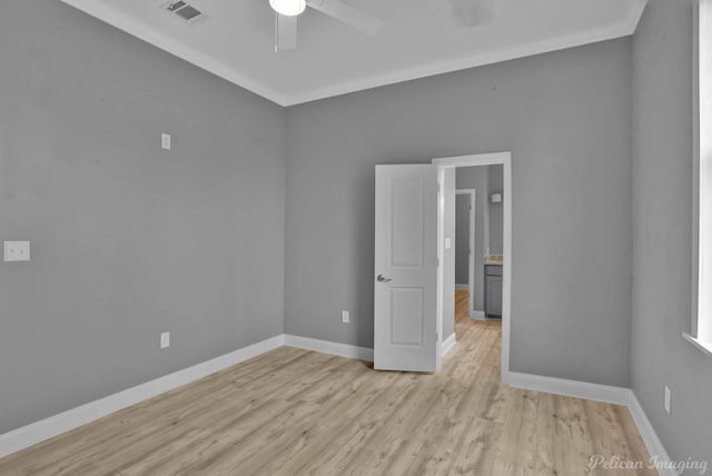 unfurnished room featuring ceiling fan, light hardwood / wood-style flooring, and ornamental molding