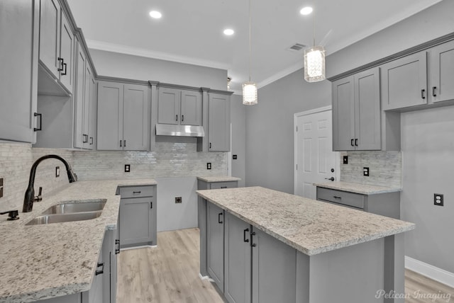 kitchen featuring gray cabinets and a center island