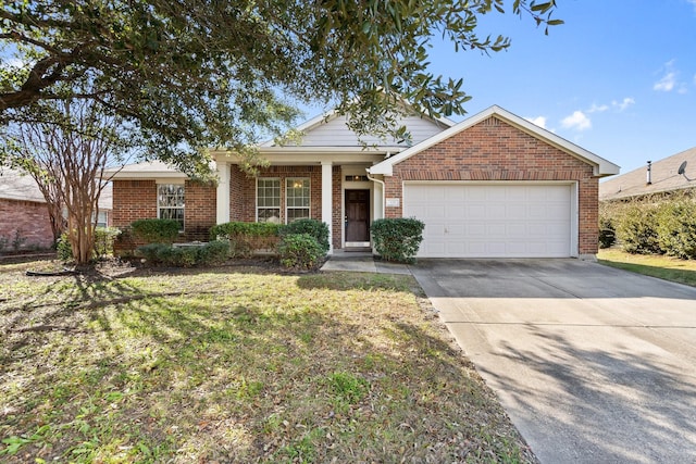 view of front of house featuring a garage and a front lawn