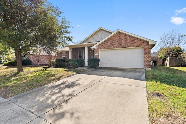 view of front of property with a front yard and a garage