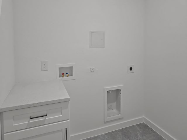 laundry room with washer hookup, hookup for a gas dryer, dark tile patterned floors, and electric dryer hookup