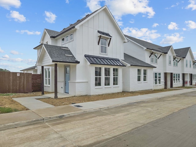 4UNITS Thorncrown Ln, Fort Worth, TX 76179 - modern inspired farmhouse with a residential view, board and batten siding, brick siding, a standing seam roof, and fence