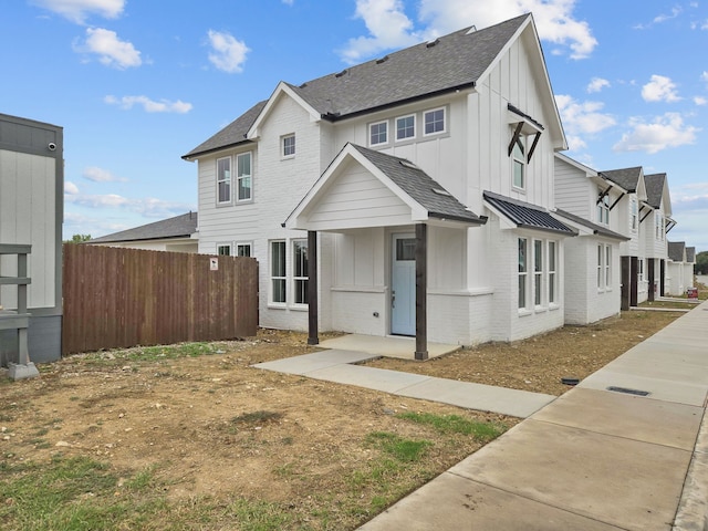 4UNITS Thorncrown Ln, Fort Worth, TX 76179 - view of front facade with roof with shingles, board and batten siding, fence, and brick siding