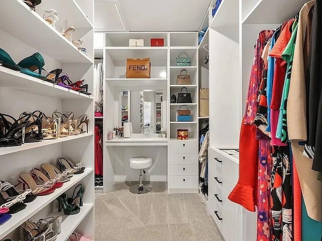 spacious closet with light colored carpet