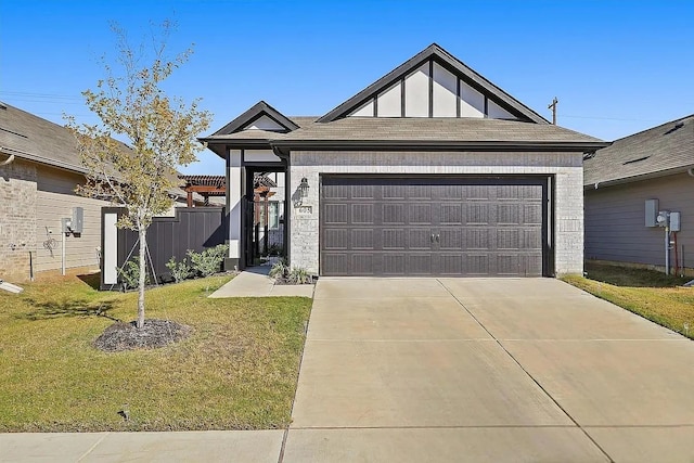 view of front facade with a front yard and a garage