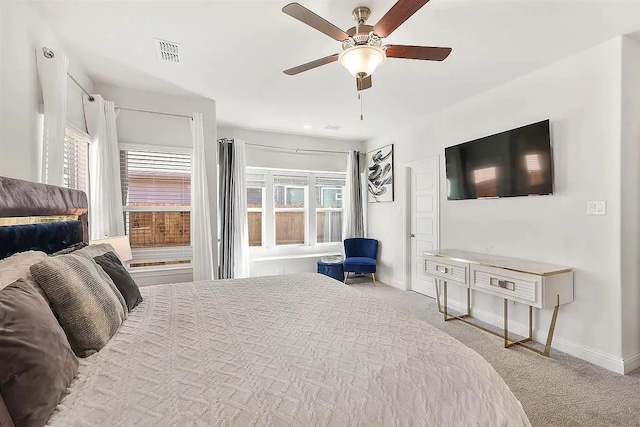 bedroom featuring ceiling fan and light colored carpet