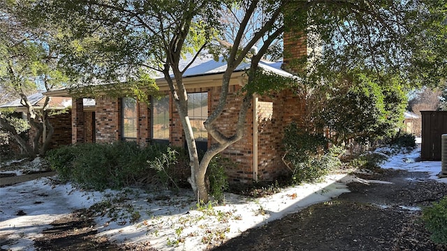 view of snow covered property