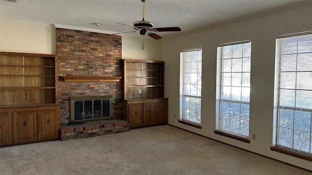 unfurnished living room featuring ceiling fan, crown molding, light colored carpet, a textured ceiling, and a fireplace