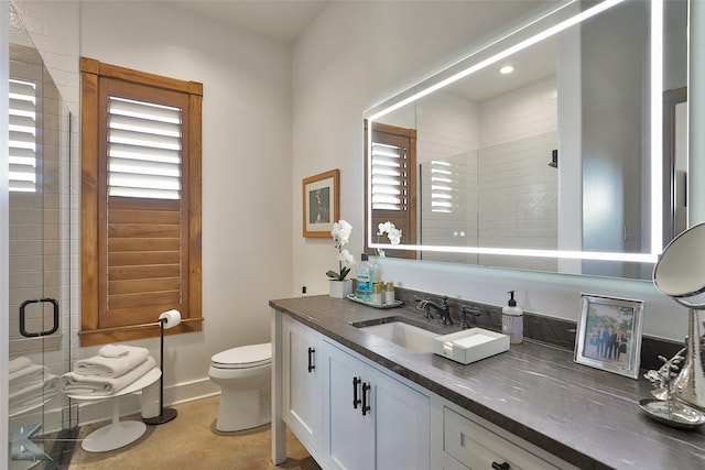 bathroom featuring vanity, toilet, an enclosed shower, and tile patterned flooring