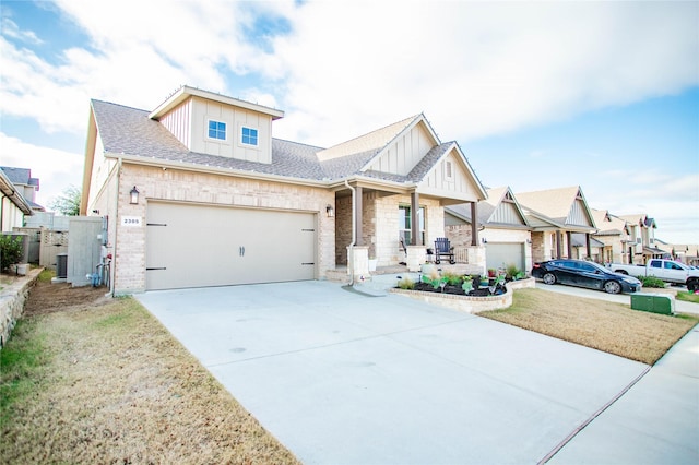 view of front of home featuring a front lawn and a garage