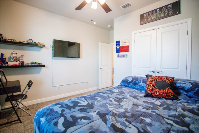 bedroom with carpet, ceiling fan, and a closet