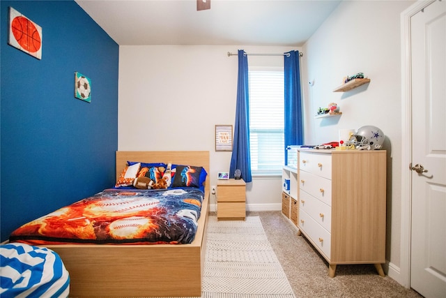 bedroom with light carpet and ceiling fan