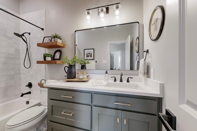 full bathroom featuring vanity, toilet, and tiled shower / bath