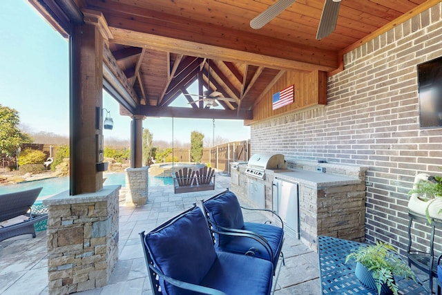 view of patio featuring a gazebo, area for grilling, and ceiling fan