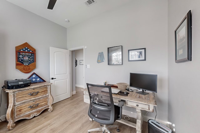 office area with light wood-type flooring and ceiling fan