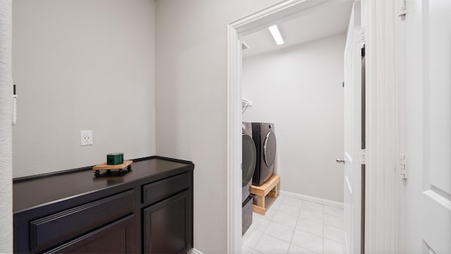 bathroom with tile patterned floors and washer and clothes dryer