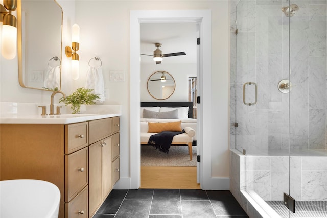 bathroom with tile patterned floors, ceiling fan, a shower with shower door, and vanity