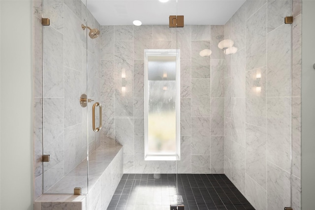 bathroom with walk in shower and tile patterned flooring