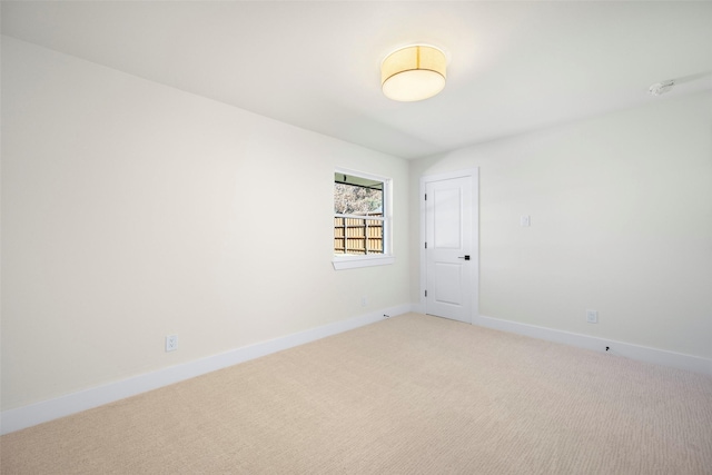 empty room with carpet flooring