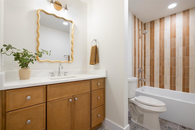 full bathroom with toilet, tiled shower / bath combo, and vanity