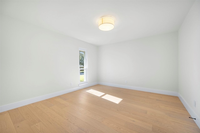 empty room with light hardwood / wood-style floors