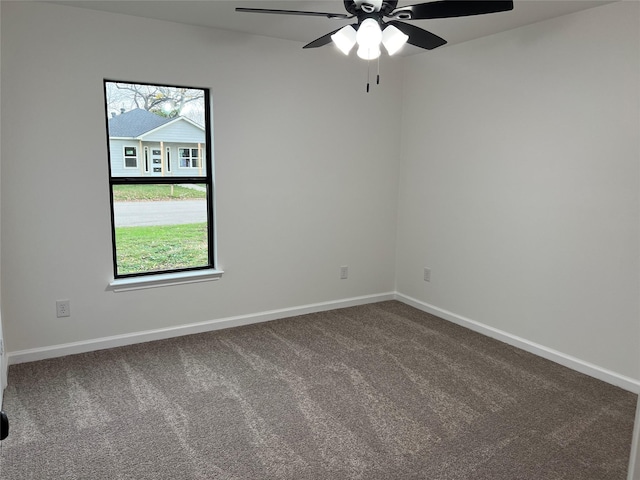 unfurnished room featuring a healthy amount of sunlight, ceiling fan, and carpet flooring