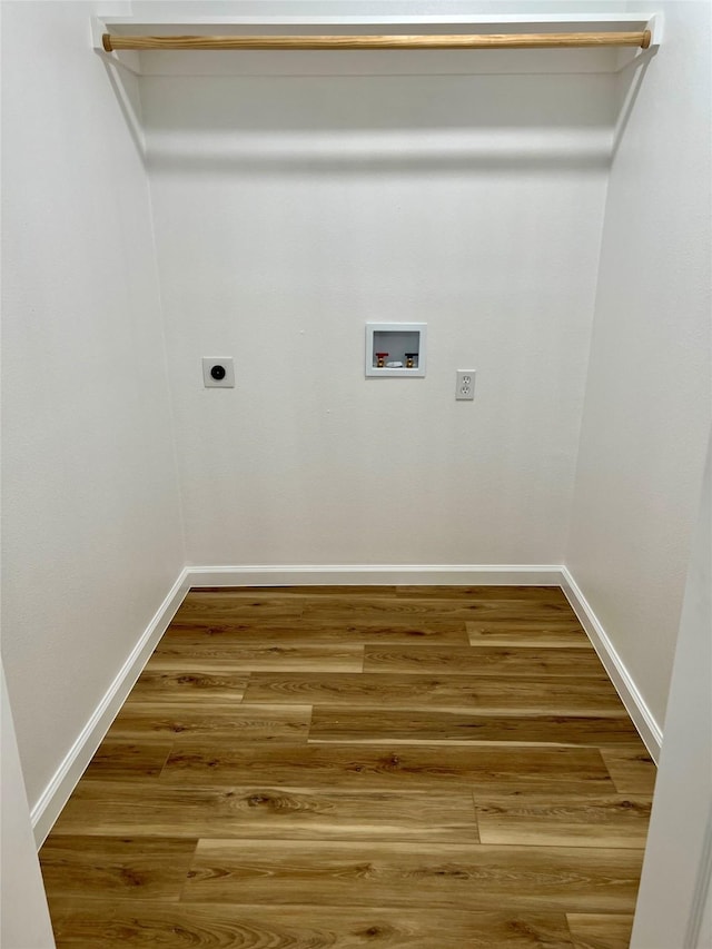 clothes washing area featuring hookup for an electric dryer, hookup for a washing machine, and wood-type flooring