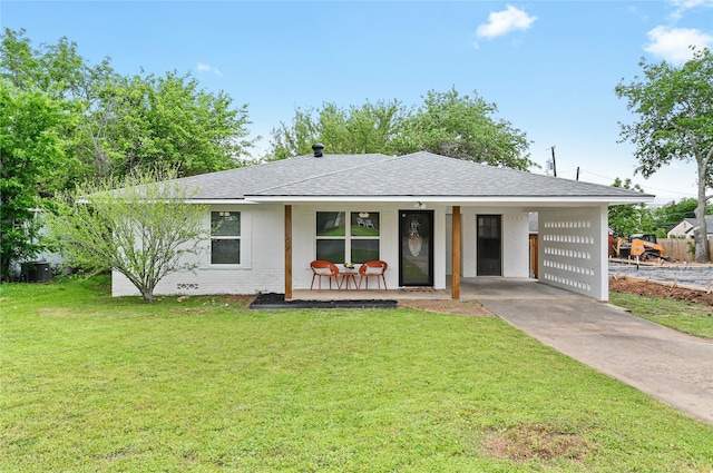 ranch-style house with a carport, a porch, and a front yard