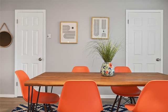 dining area with hardwood / wood-style flooring