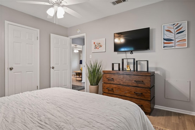 bedroom featuring hardwood / wood-style floors and ceiling fan